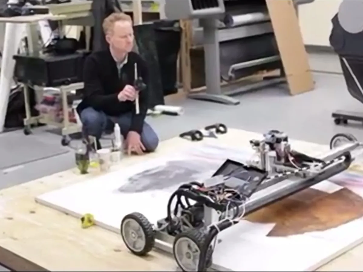 Barnaby Furnas with a Matr painting machine working across a canvas