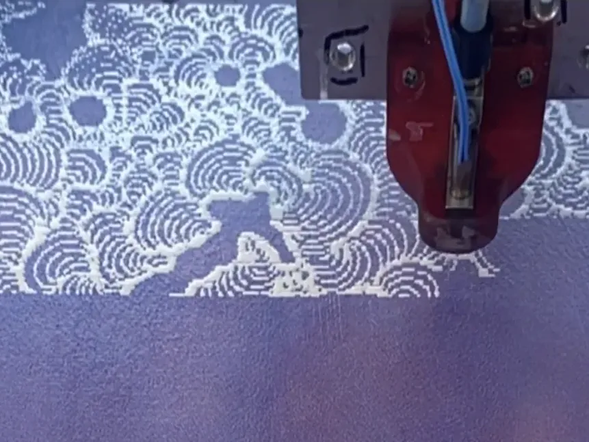 Fine raised lines being drawn across a work by James Jean