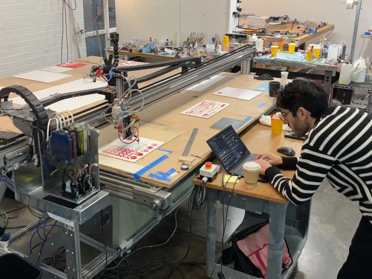 A Matr machine drawing red circles for a work by Tyler Hobbs